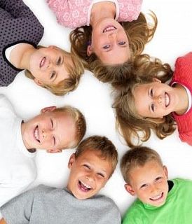 4554180-closeup-portrait-of-young-boys-and-girls-lying-in-a-circle-on-floor-isolated-on-white-backgroundm.jpg